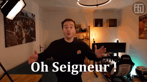 a man wearing an ellesse shirt stands in a room with the words oh seigneur