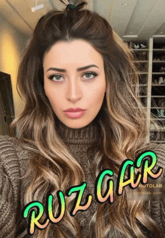 a woman in a sweater with the word ruzgar on her face