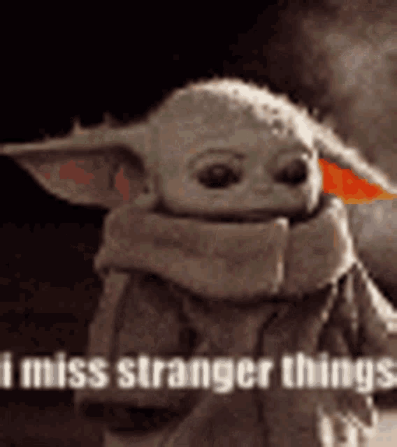 a baby yoda is wearing a scarf and says `` i miss strange things '' .