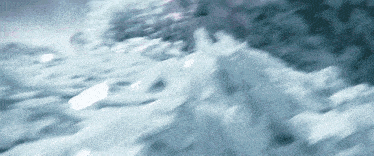 a close up of a pile of snow on a snowy hill