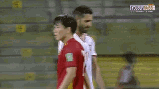 two soccer players are standing next to each other with the number 7 on their jersey