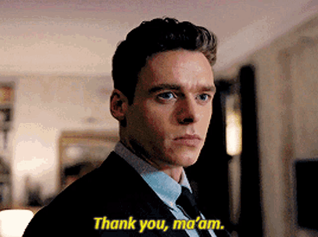 a man in a suit and tie is saying thank you ma 'am