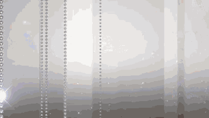 a white background with a row of pearls hanging from it