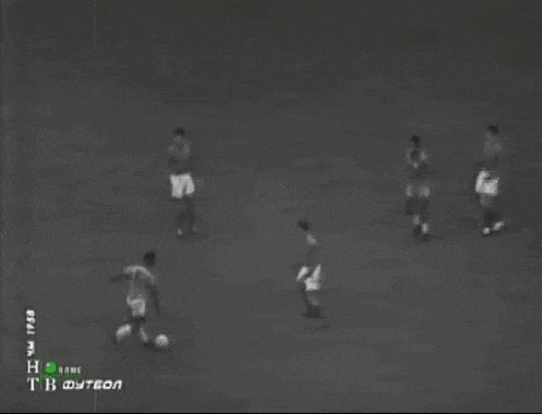 a black and white photo of a soccer game with the letters tb on the bottom