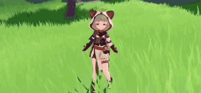 a girl in a cat costume is standing in a field of tall grass .
