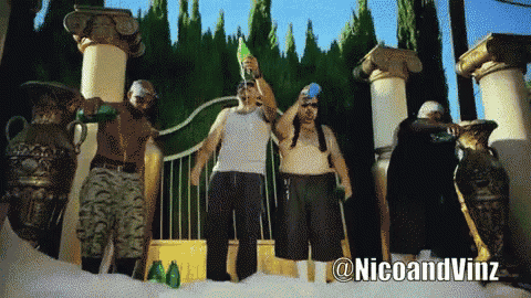 a group of men standing in front of a gate with a nicoandvinz watermark