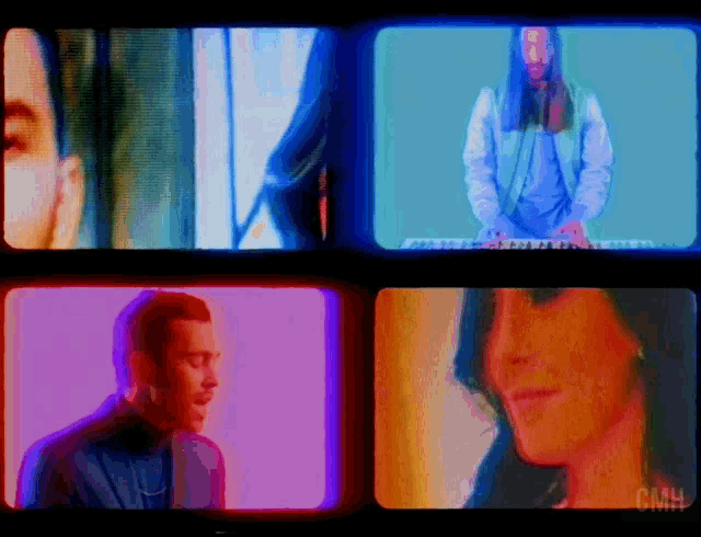 a man is playing a keyboard while a woman is looking at him