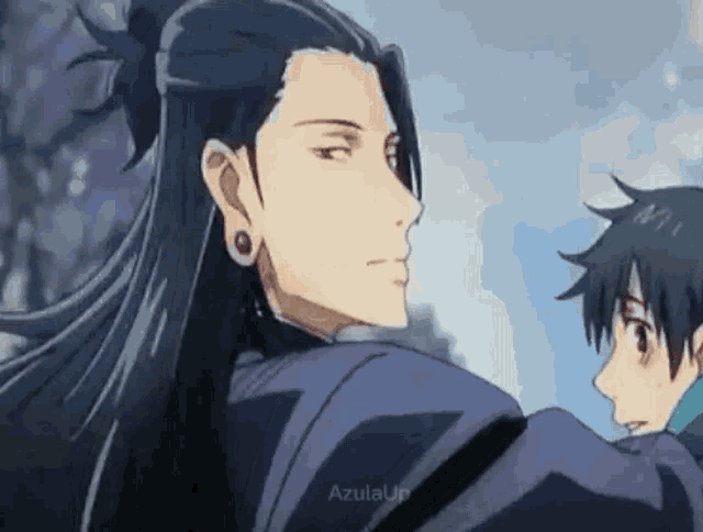 a man with long black hair is standing next to a boy with shorter hair .
