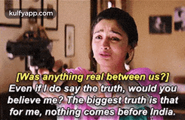 a woman is crying while holding a gun in her hand and saying `` was anything real between us ? ''