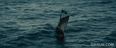 a gif from gifrun.com shows a boat in the middle of a large body of water