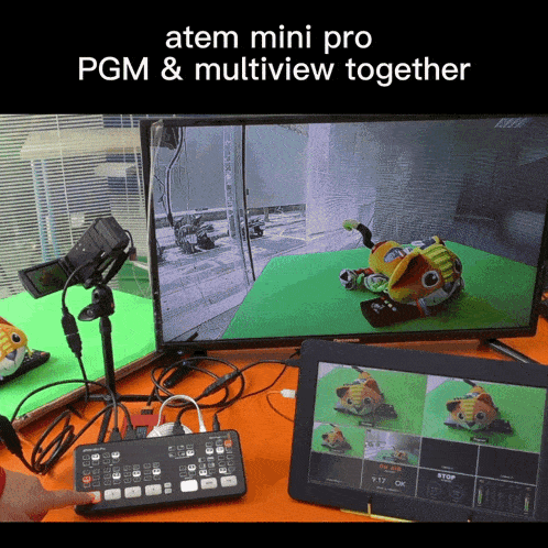 a screen shows a stuffed animal on a green background with the words atem mini pro pgm & multiview together