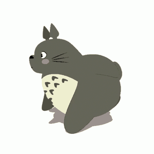 a cartoon totoro is running on a white background and looking at the camera .
