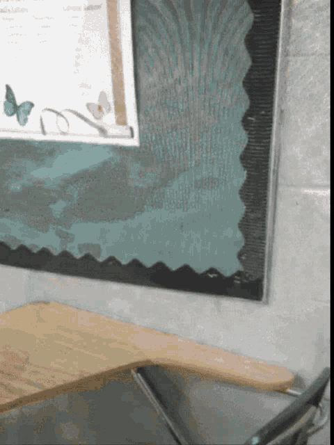 a bulletin board with a picture of butterflies and the word letters on it