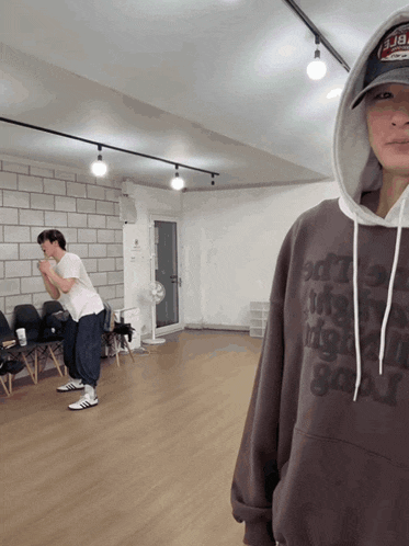 a man wearing a hoodie that says ' edt ' on it