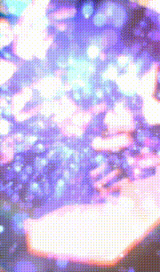 a blurry picture of a purple and pink background with a purple circle in the middle
