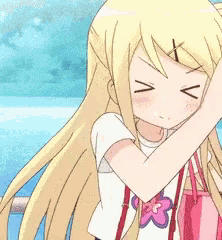a blonde anime girl with a flower on her shirt is covering her mouth with her hand