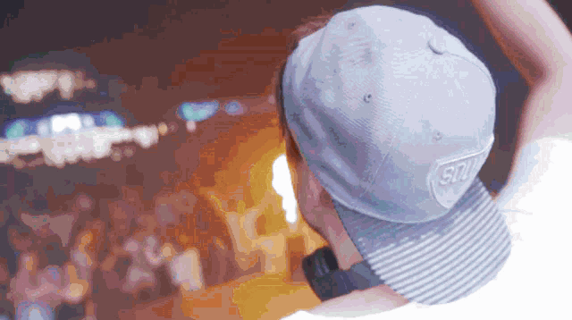 a man wearing a hat that says ' snl ' on it