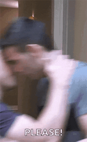 a blurry picture of a man 's face with the word please in the corner .