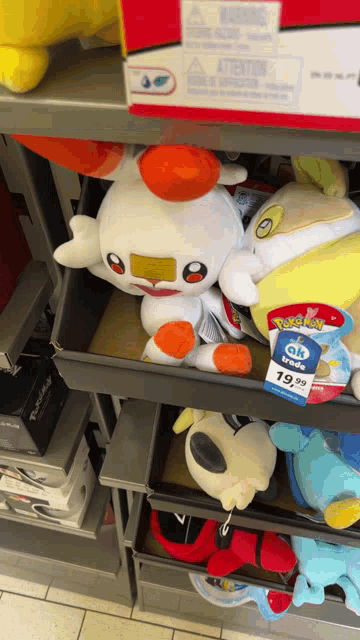 a pokemon stuffed animal is sitting on a shelf for 19.99