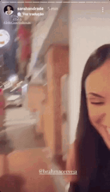 a woman is standing in a room with her eyes closed and a caption that says sarahandrade