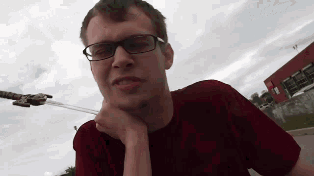 a man wearing glasses and a t-shirt that says ' abercrombie and fitch ' on it