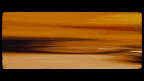 a blurred image of a yellow and orange background