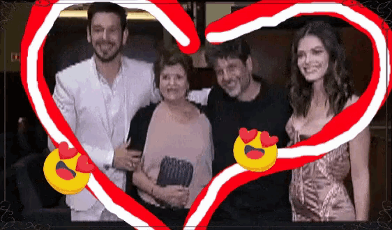 a group of people are posing for a picture with a heart in the middle