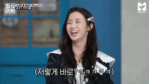 a girl with a name tag that says ' a ' on it is smiling