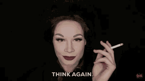 a woman is smoking a cigarette and says `` think again '' .