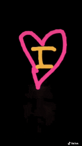 a pink heart with a yellow letter o drawn on it