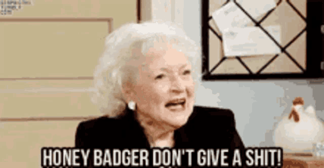an elderly woman is saying honey badger don 't give a shit .