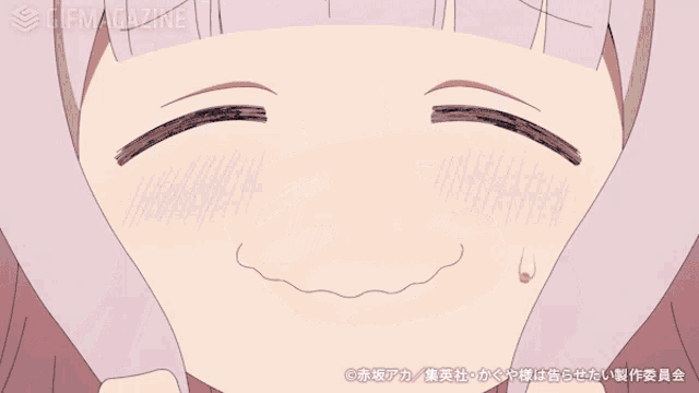 a girl with a bow on her head is making a face
