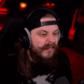 a man with a beard and mustache is wearing headphones