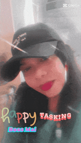 a woman wearing a black hat with the words happy tasking written on it