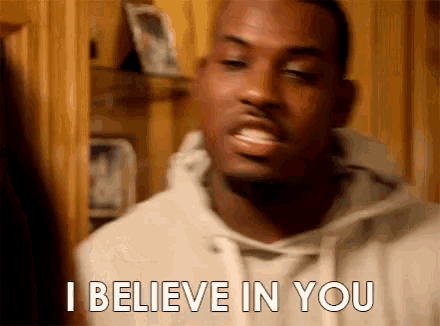 a man is saying i believe in you in a room