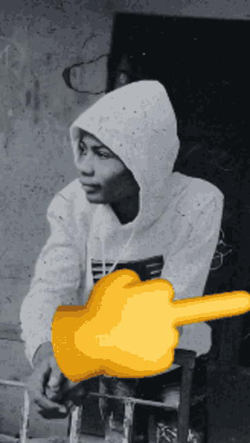 a black and white photo of a man in a hoodie