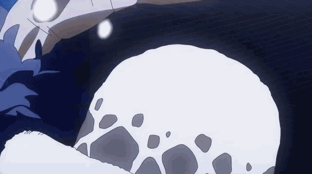 a cartoon drawing of a skull with a light coming out of it .