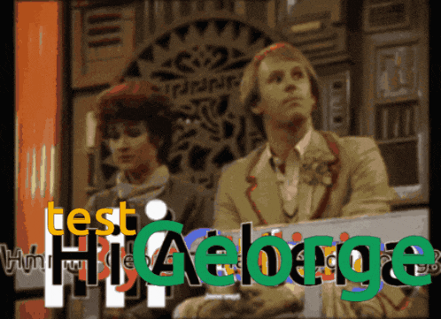 a man and a woman are sitting in front of a sign that says test higeorge