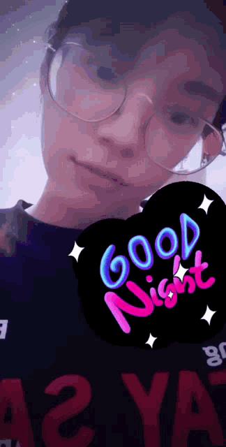 a girl with glasses and a good night sticker