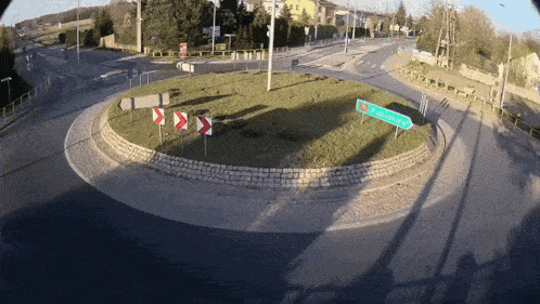 a roundabout with a sign in the middle that says zagorska