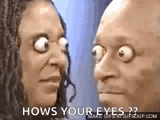 a man and a woman are looking at each other with their eyes very big .