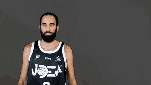 a man with a beard wears a jersey that says joea on it