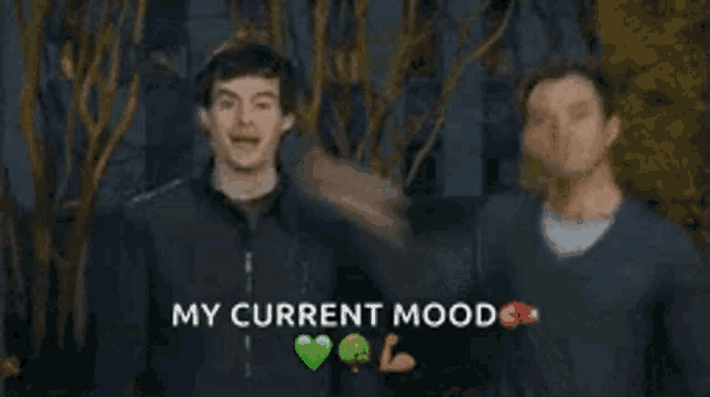 a man is holding his fist up in the air with the words `` my current mood '' written above him .