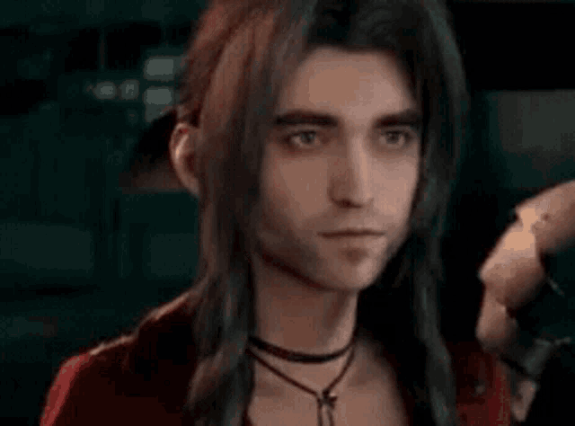 a man with long hair is wearing a choker and a red jacket .