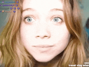 a close up of a girl 's face with the words travel vlog written below it