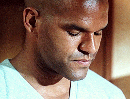 a close up of a man 's face looking down