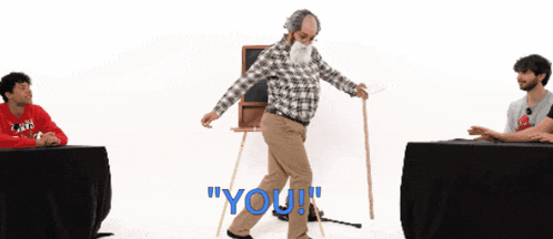 a man standing on a mat with the word " you " written in blue