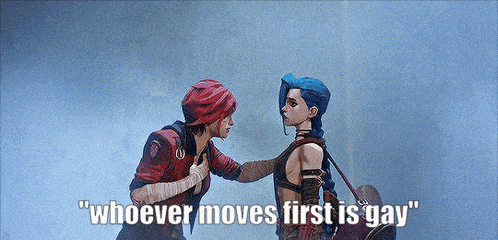 two women are standing next to each other with the words " whoever moves first is gay "
