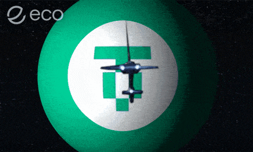 a green ball with a white circle with a t in it