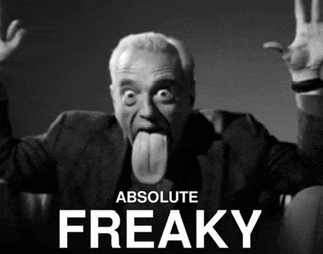a black and white photo of a man sticking out his tongue with the words absolute freaky below him